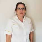 Photo of Tracy Eves, trainee nursing associate, in uniform